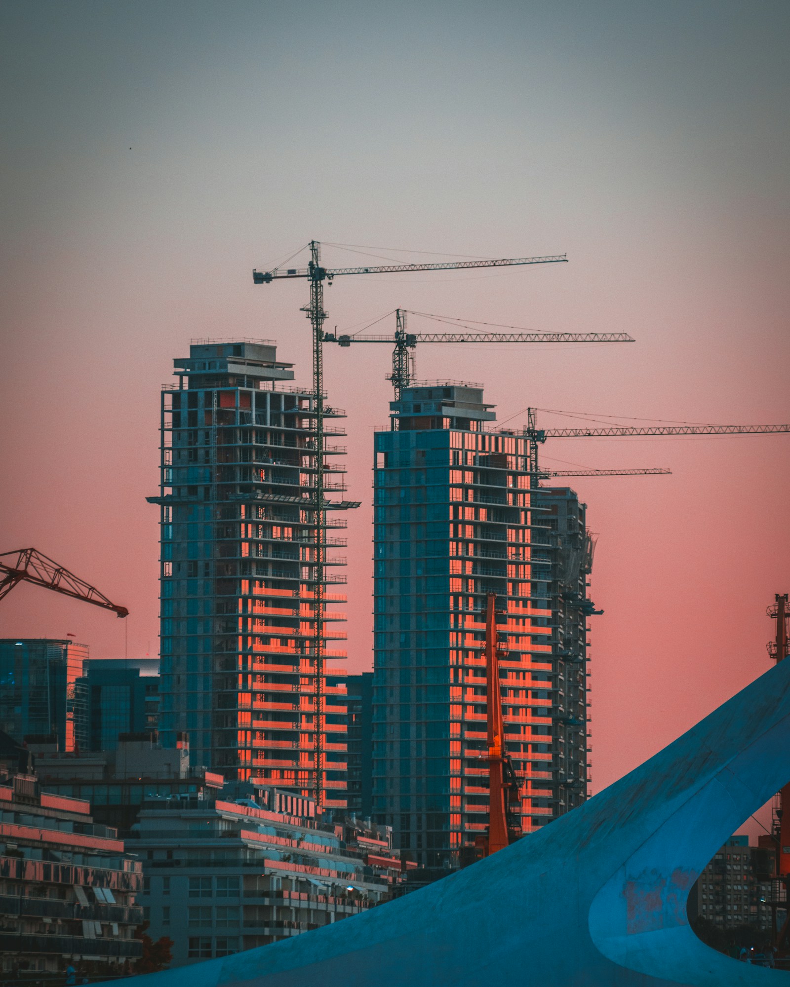 High-rise construction at sunset, residential real estate development